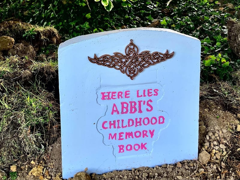 Abbi's Childhood Memory Book will be dug up on her 21st birthday in 2033.