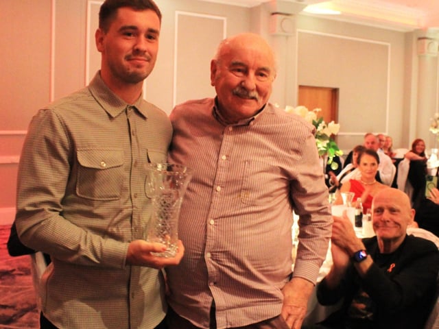 Derry City goalkeeper Brian Maher presents Gang of Four member and ex-City keeper Eddie Mahon with his special recognition award.