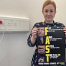 Dr Elizabeth Best, Stroke Speciality Doctor at Altnagelvin Hospital with the FAST poster.