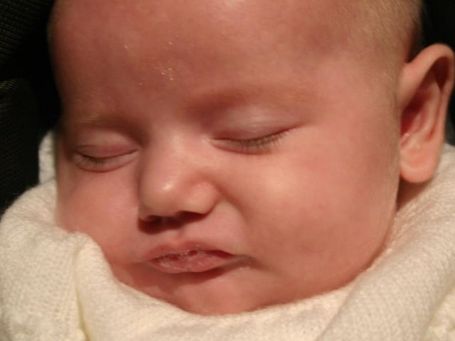 Baby Niamh Orla McClean takes a rest  at her Christening Party 9346dd : Derry Parties & Celebrations October 2005: Baby McClean.
