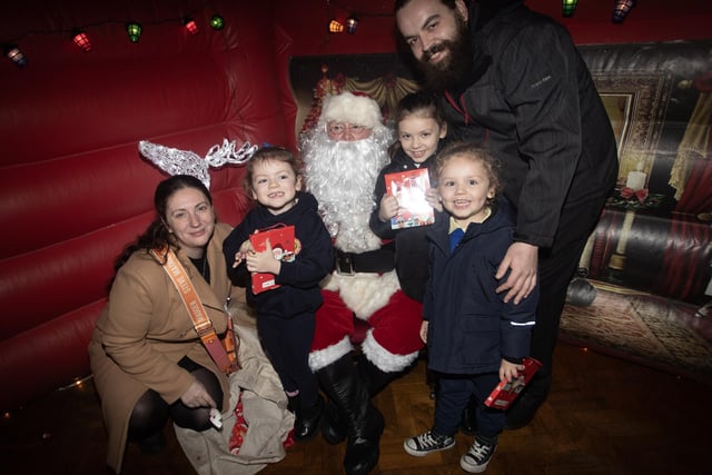 One of the many families who visited Santa Claus during the Holy Child PS Christmas Extravaganza on Thursday night. (Photos: Jim McCafferty Photography)