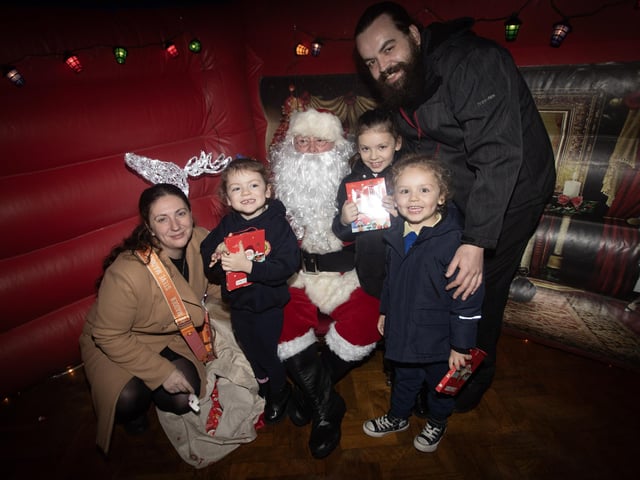 One of the many families who visited Santa Claus during the Holy Child PS Christmas Extravaganza on Thursday night. (Photos: Jim McCafferty Photography)