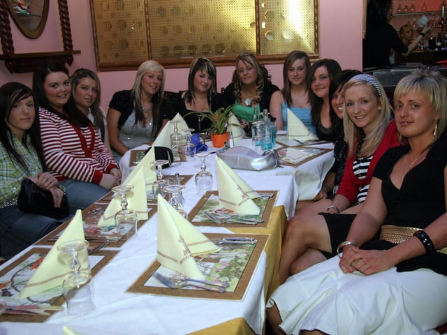 Sarah and her party guests get ready to enjoy a meal at the Imperial City restaurant 0045JML : Parties and nights out in Derry and Donegal in February 2006.