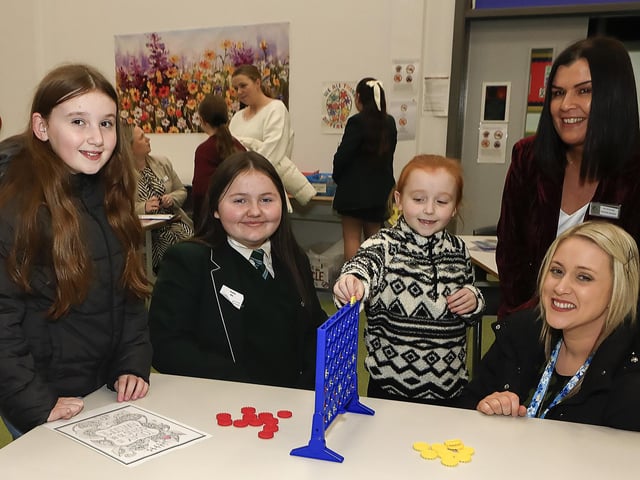 Miss Bridgeen McGonagle and student with parent Amanda Mellon and P7 pupils at St. Cecilia’s College Open Night. (Photo - Tom Heaney, nwpresspics)