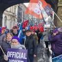 Striking public sector workers making their way down Shipquay Street.