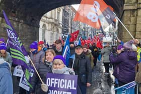 Striking public sector workers making their way down Shipquay Street.