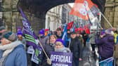Striking public sector workers making their way down Shipquay Street.
