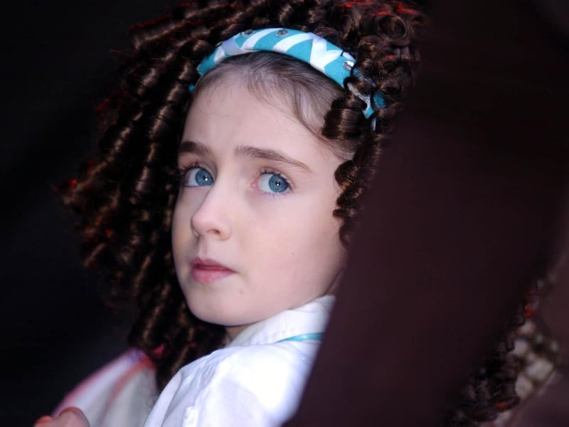 This Irish dancer waits nervoously in the wings as she waits to take to the stage at Derry's Guildhall. : St Patrick's Day in Derry in 2006.