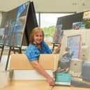 Derek McDermott, Translink Customer Service Co-ordinator at the North West Transport Hub with photography competition award winner Breige Young with the image of her grandson waving good bye.