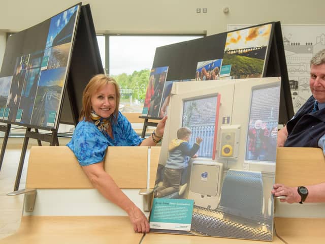 Derek McDermott, Translink Customer Service Co-ordinator at the North West Transport Hub with photography competition award winner Breige Young with the image of her grandson waving good bye.