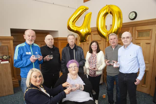 The Mayor, Sandra Duffy making a presentation to the original committee of the Waterside Half Marathon during a reception to mark their 40th anniversary at the Guildhall on Thursday afternoon last. Included are Gerry Lynch, Carmel McCallion, Dennis McGowan, Sandra Smyth, Charlie Large, Gerry Craig and Micky McDermott.