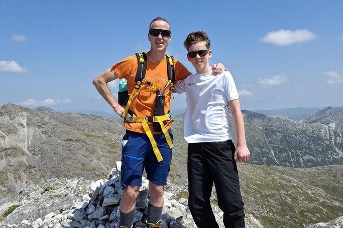 Local father and son duo Andrew Maguire and 15-year-old Shae Maguire at the summit of one of the Twelve Bens in Connemara.