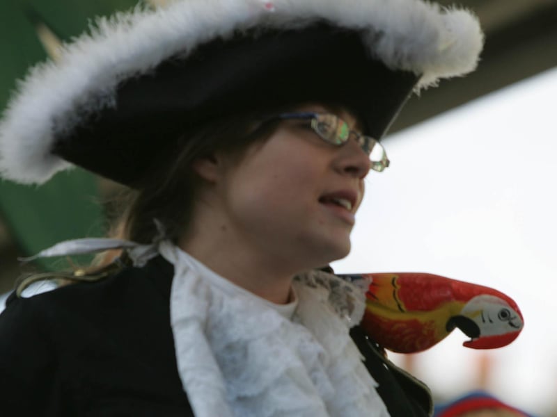 Polly the Parrott looks a little knackered as she and her master reach trhe end of the parade in Buncrana. (1903JB18) : St Patrick's Day in Buncrana in 2006