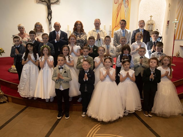 Pupils from St. Brigid's Primary School who received the Sacrament of First Holy Communion from Fr. Sean O'Donnell at St. Brigid's Church, Carnhill on Friday last. (Photo: Jim McCafferty Photography)
