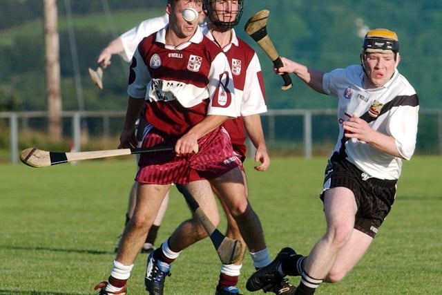 Kevin Lynch's Paul Farren loses possession following this challenge at Banagher. (0209C25)