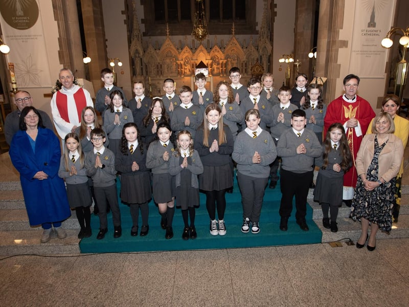 Pupils from Model Primary School who received the Sacrament of Confirmation from Fr. Shaun Doherty at St. Eugene's Cathedral on Friday evening last. Included from left are Mr. Michael Bradley, Vice Principal, Mrs. Avril Coyle, P7 teacher, Fr. Paul Farren, Mrs. Michelle Ramsey, Principal and Mrs. Meghan Coyle, P7 teacher. (Photo: Jim McCafferty Photography)