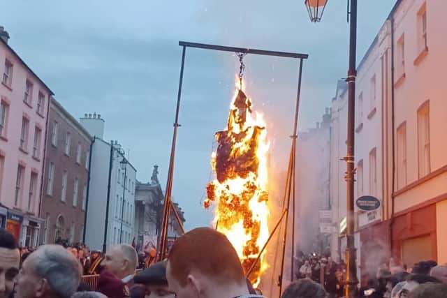 An effigy of Robert Lundy in fire on the city centre.
