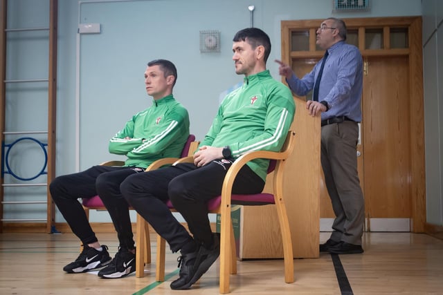 Senior teacher Mr. Gerry Beattie introducing the successful u-18 St. Joseph's coaches Emmett McGinty and Conor Lynch to the assembly.