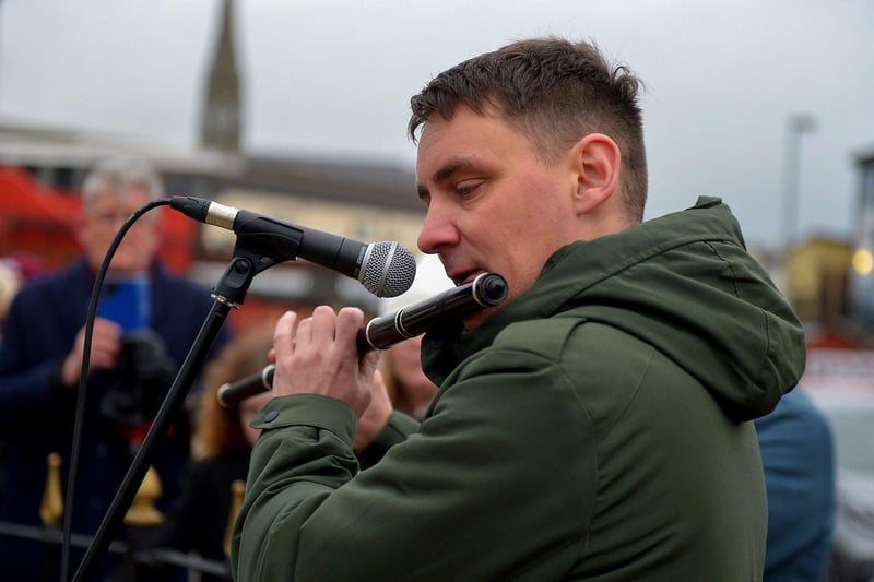 Ciaran Carlin plays a lament at the Bloody Sunday monument in Josephs Place on Monday afternoon where a one minute silence was observed on the 51st anniversary of the Bloody Sunday massacre. Photo: George Sweeney. DER2306GS  45