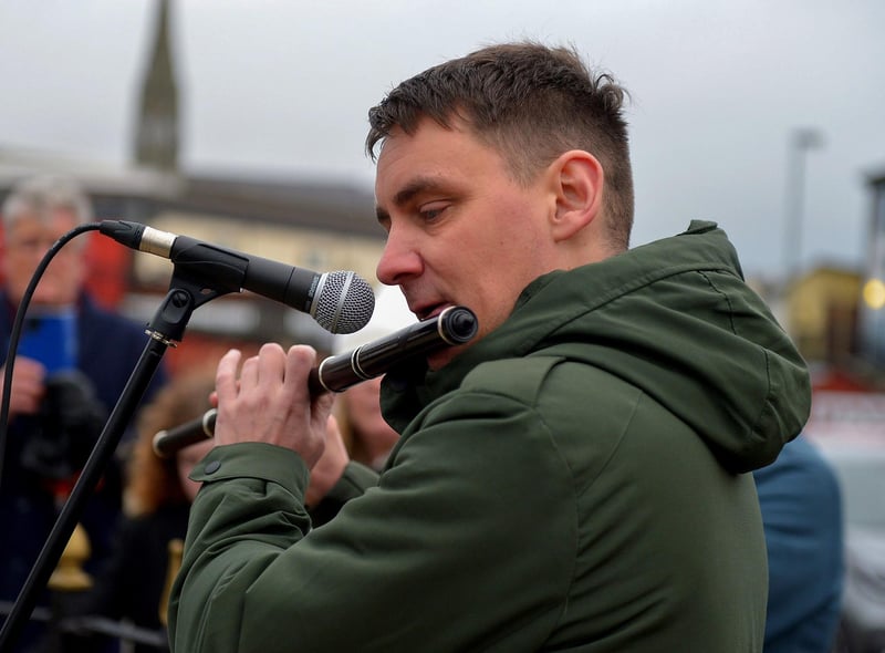 Ciaran Carlin plays a lament at the Bloody Sunday monument in Josephs Place on Monday afternoon where a one minute silence was observed on the 51st anniversary of the Bloody Sunday massacre. Photo: George Sweeney. DER2306GS 45