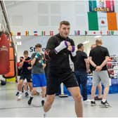 Connor Coyle leads these young boxers in some shadow boxing during a recent training session at St Joseph's ABC.