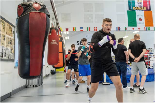 Connor Coyle leads these young boxers in some shadow boxing during a recent training session at St Joseph's ABC.