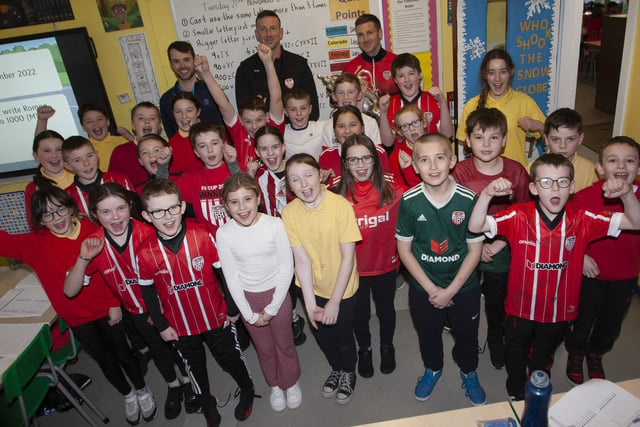 Mr. Hargan and his Primary 7 class welcome Patrick and Shane McEleney to Steelstown Primary School. (Photo: Jim McCafferty)