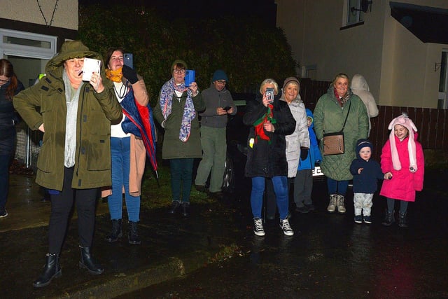 People gather to greet Santa at the Creggan Community Collective, Cromore Gardens, on Friday evening last. DER2249GS – 29