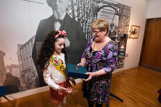Under-11s Ulster Gold medallist Tori McLaughlin receiving a presentation to mark her success from Derry City & Strabane District Council Deputy Mayor Angela Dobbins.