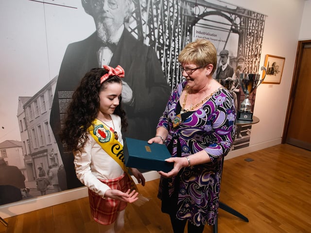 Under-11s Ulster Gold medallist Tori McLaughlin receiving a presentation to mark her success from Derry City & Strabane District Council Deputy Mayor Angela Dobbins.