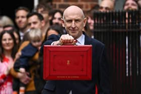 Britain's Chancellor of the Exchequer John Healey poses with the Budget Box as he left 11 Downing Street. (Photo by Dylan Martinez / POOL / AFP via Getty Images)