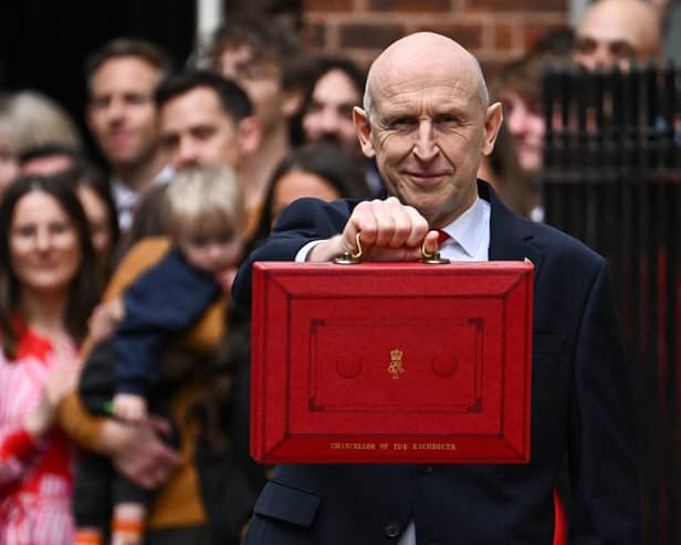 Britain's Chancellor of the Exchequer John Healey poses with the Budget Box as he left 11 Downing Street. (Photo by Dylan Martinez / POOL / AFP via Getty Images)
