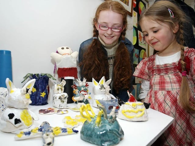 Sisters, 9-year-old Sorcha and 4-year-old Aoife Drummond, enjoy looking around the end of term exhibition, held at the Eden Arts Centre. 0604GM07EDEN