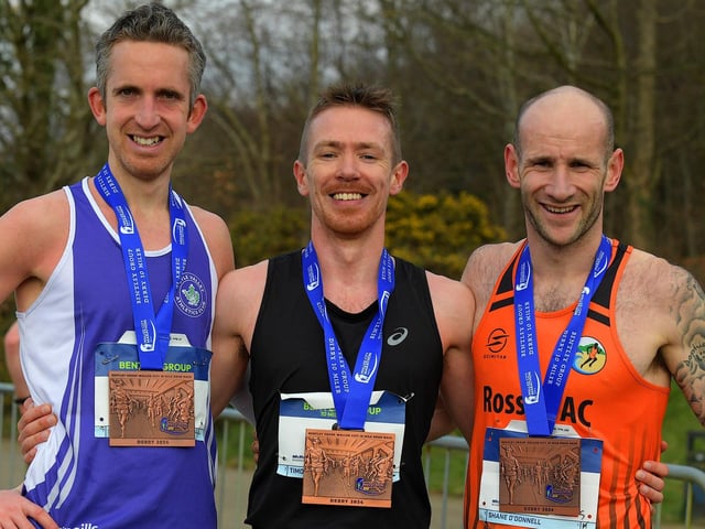 Race winner Timothy Johnston (centre) Annadale Strikers, second place Foyle Valley’s Scott Rankin (left) and Shane O’Donnell, Rosses AC who finish third. Photo: George Sweeney
