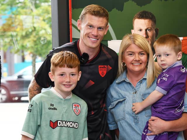 Republic of Ireland star James McClean pictured with Daimhin, Sarah and Tiarnan Elliott at the launch the O'Neills Foyle Cup training kit in the O'Neills Superstore, Waterloo Place.