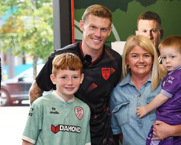 Republic of Ireland star James McClean pictured with Daimhin, Sarah and Tiarnan Elliott at the launch the O'Neills Foyle Cup training kit in the O'Neills Superstore, Waterloo Place.