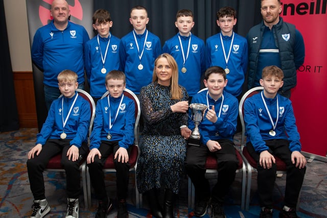 Caroline Casey, manager, O’Neills Sports Superstore, Derry presenting the Winter Cup  to winners Oxford United 2010s at the Annual Awards in the City Hotel on Friday night last. Included are coaches Charlie Ferry and Darren Melly. (Photo:  Jim McCafferty)