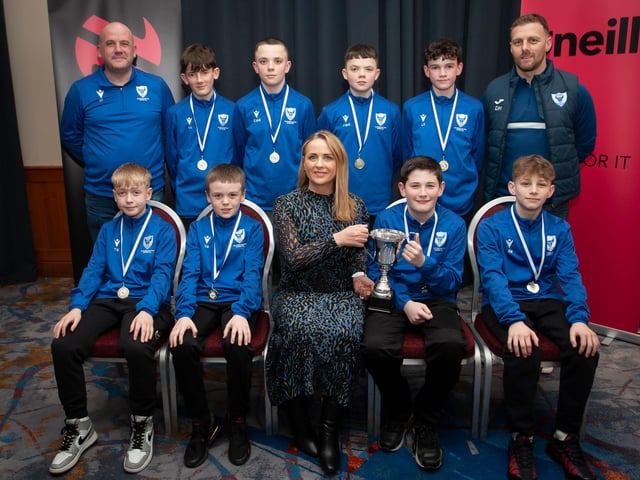 Caroline Casey, manager, O’Neills Sports Superstore, Derry presenting the Winter Cup to winners Oxford United 2010s at the Annual Awards in the City Hotel on Friday night last. Included are coaches Charlie Ferry and Darren Melly. (Photo: Jim McCafferty)
