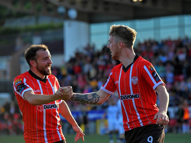 Paul McMullan congratulates goal scorer Jamie McGonigle. Photo: George Sweeney. DER2327GS - 024