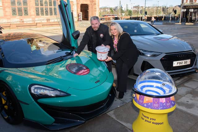 The Mayor Councillor Sandra Duffy pictured with Gary as this years Mayoral Charity, First Housing Aid and Support Services wil be the be the beneficiary of Supercar Saturday which is taking place on the 13th of May. Two of the stars which will be on display are a Maclaren and an Audi RS7. Picture Martin McKeown. 14.03.23
