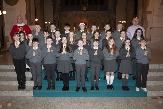 Pupils from Model Primary School who received the Sacrament of Confirmation from Fr. Paul Farren at St. Eugene’s Cathedral on Wednesday afternoon last. On right is Mr. Michael Bradley, Vice Principal. (Photo: Jim McCafferty Photography)