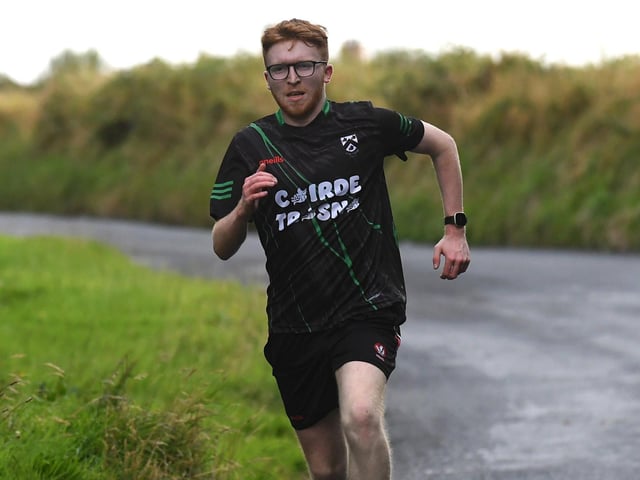 'Canter on the Corrody' 5k winner Damien McGuinness crosses the finishing line. Photo: George Sweeney