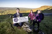 Mayor of Causeway Coast and Glens, Councillor Ciarán McQuillan pictured with Clare Quinn, Council Trade Engagement Officer and Mairéad Whall, Far and Wild at the launch of the 2025 Causeway Coast and Glens Walking Festival.