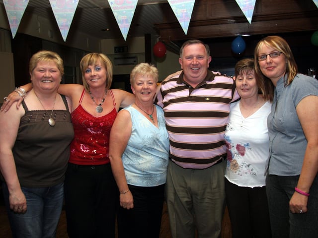 Donal smiles for the camera with his sisters-in-law, Lorraine, Geraldine, Maire, Siobhan and Teresa 0221JML : Parties and celebrations across Derry in May 2006.