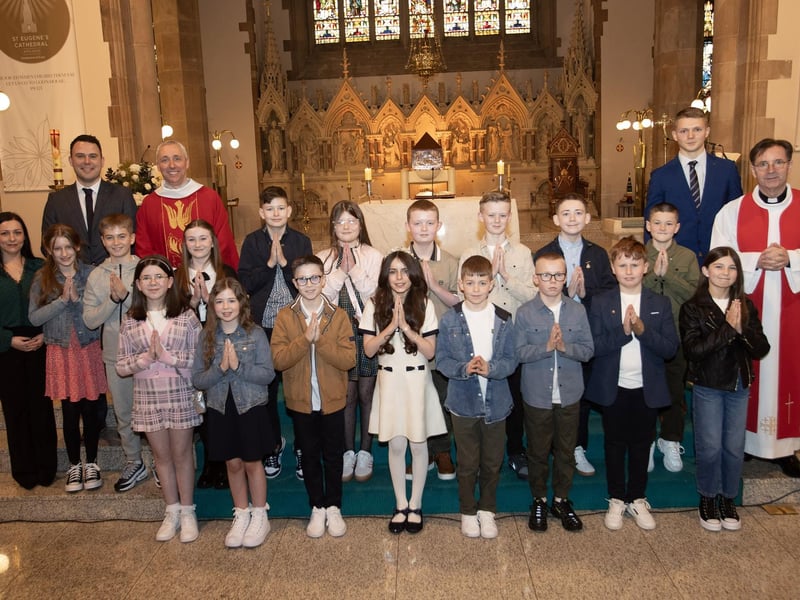 Pupils from Rosemount PS who received the Sacrament of Confirmation from Fr. Paul Farren at St. Eugene's Cathedral on Friday last. Included are Mrs Quinn, teacher, Mrs Flood, classroom assistant, Mr Gallagher, student teacher and Fr. Shaun Doherty. (Photo: Jim McCafferty Photography)