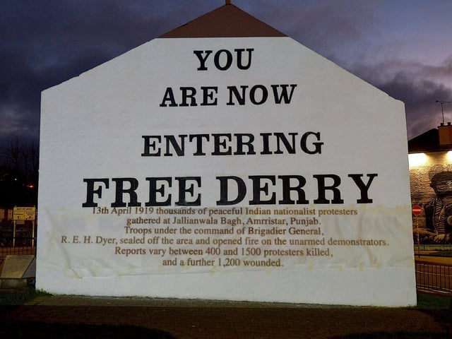 One of the projected images, on Free Derry Corner on Thursday evening, of the British colonial past from the ‘The Sun Never Set And The Blood Never Dries’ art project created by Art Everywhere. The event was part of Bloody Sunday 51 anniversary. Photo: George Sweeney. DER2305GS – 107