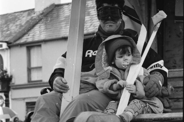 Getting a chairlift up Main Street at the 1993 Buncrana St. Patrick's Day parade.