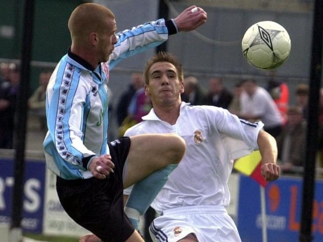 Jamie Hughes makes an acrobatic attempt to get on the ball.