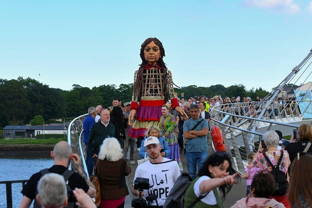 Global human rights icon Little Amal crosses the Peace Bridge towards Guildhall Square on Monday afternoon. Photo: George Sweeney