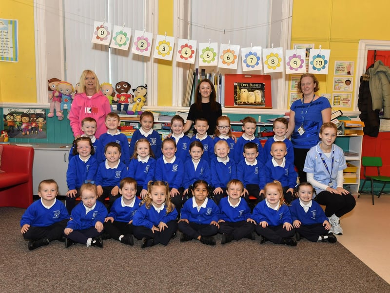 Miss Molloy (centre) pictured with her P1 class and classroom assistants at Nazareth house Primary School.